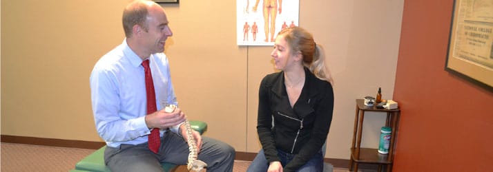 Chiropractor Neenah WI Matthew Clover with Patient Chiropractor Neenah WI Matthew Clover with Patient